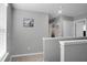 Hallway with neutral paint and carpet leading to bedrooms and bathroom at 436 Blue Elderberry, Moncks Corner, SC 29461