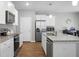 Bright kitchen with white cabinets, stainless steel appliances, and granite countertops for a modern feel at 436 Blue Elderberry, Moncks Corner, SC 29461