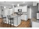 Kitchen with granite countertops, white cabinets, stainless appliances, and an island with bar seating at 436 Blue Elderberry, Moncks Corner, SC 29461