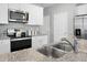 Modern kitchen featuring granite countertops, stainless steel appliances, and ample cabinet space at 436 Blue Elderberry, Moncks Corner, SC 29461