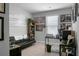 Bright home office with a desk, comfortable seating, and natural light at 436 Blue Elderberry, Moncks Corner, SC 29461
