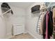 Organized walk-in closet featuring white shelving and a built-in dresser, maximizing storage space and functionality at 467 Nelliefield Trl, Wando, SC 29492