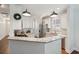 A well-lit kitchen features granite countertops and stainless steel appliances at 467 Nelliefield Trl, Wando, SC 29492
