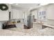 A bright kitchen with granite countertops, stainless steel appliances, and white cabinetry at 467 Nelliefield Trl, Wando, SC 29492