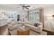 Bright and airy living room with hardwood floors, comfortable seating, and lots of natural light at 467 Nelliefield Trl, Wando, SC 29492