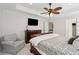 Spacious main bedroom with ceiling fan, a seating area, and large windows at 467 Nelliefield Trl, Wando, SC 29492