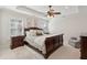 Cozy main bedroom with ceiling fan, windows with shutters, and ample natural light at 467 Nelliefield Trl, Wando, SC 29492