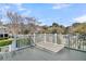 A relaxing covered balcony with white railings features a neighborhood view at 4922 Sound View Dr, Mount Pleasant, SC 29466