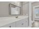 Bright bathroom featuring quartz countertop, white cabinets, and a stylish mirror and lighting at 4922 Sound View Dr, Mount Pleasant, SC 29466