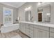 Spacious bathroom featuring double vanity, soaking tub, and natural light at 4922 Sound View Dr, Mount Pleasant, SC 29466