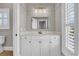 Bathroom featuring modern fixtures, a quartz countertop, and ample storage space in the elegant white cabinets at 4922 Sound View Dr, Mount Pleasant, SC 29466
