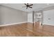 Spacious bedroom featuring hardwood floors, ceiling fan, and ample natural light at 4922 Sound View Dr, Mount Pleasant, SC 29466