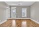 Bedroom with hardwood floors, access to an outdoor area, and plantation shutters for optimal light control at 4922 Sound View Dr, Mount Pleasant, SC 29466