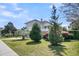 Well-manicured front yard with lush landscaping and a charming two-story home at 4922 Sound View Dr, Mount Pleasant, SC 29466
