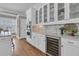 Gourmet kitchen featuring stainless steel appliances, glass-front cabinets, and a built-in wine fridge at 4922 Sound View Dr, Mount Pleasant, SC 29466