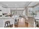 Open-concept kitchen flowing into the dining and living spaces, featuring an island with bar seating at 4922 Sound View Dr, Mount Pleasant, SC 29466