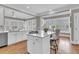 Bright kitchen with white cabinets, stainless steel appliances, and island with gas cooktop at 4922 Sound View Dr, Mount Pleasant, SC 29466