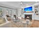 Living room with fireplace, built-in shelves, and a balcony at 4922 Sound View Dr, Mount Pleasant, SC 29466
