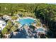 Aerial shot of pool and clubhouse, surrounded by lush trees and landscaping at 4922 Sound View Dr, Mount Pleasant, SC 29466