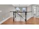 Staircase with black railing, and pendant lighting, plus natural light from large windows at 4922 Sound View Dr, Mount Pleasant, SC 29466