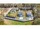 Aerial view of the neighborhood, showcasing landscaping, driveways, and surrounding greenery at 523 Coaxum Rd, Mount Pleasant, SC 29464