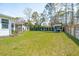 Expansive backyard featuring a hammock, playhouse and screened-in porch at 523 Coaxum Rd, Mount Pleasant, SC 29464