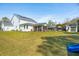 Large backyard features solar panels, screened-in porch, and storage shed at 523 Coaxum Rd, Mount Pleasant, SC 29464