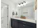 Modern bathroom featuring a sleek vanity with a white countertop, and stylish black cabinetry at 523 Coaxum Rd, Mount Pleasant, SC 29464