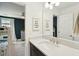 Clean bathroom featuring a dark vanity with marble countertop and decorative wall hangings at 523 Coaxum Rd, Mount Pleasant, SC 29464