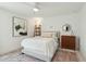 Bright bedroom featuring a comfortable bed, a decorative ladder, and a vintage-style rug at 523 Coaxum Rd, Mount Pleasant, SC 29464