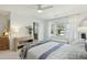 Bedroom with a large window and a comfortable bed adorned with patterned linens and wooden dresser at 523 Coaxum Rd, Mount Pleasant, SC 29464