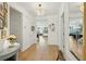 Bright entryway featuring light hardwood floors and a decorative light fixture at 523 Coaxum Rd, Mount Pleasant, SC 29464