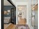 Elegant foyer with hardwood floors, a view of the living spaces, and sophisticated decor elements at 523 Coaxum Rd, Mount Pleasant, SC 29464