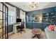 Bright home office with built-in shelving, a stylish chandelier, and a comfortable layout, ideal for working at 523 Coaxum Rd, Mount Pleasant, SC 29464