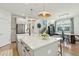 Open concept kitchen with a large island, stainless steel appliances and hardwood floors at 523 Coaxum Rd, Mount Pleasant, SC 29464
