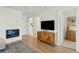 Open living area featuring stylish wood floors and a modern media console and access to other rooms at 523 Coaxum Rd, Mount Pleasant, SC 29464