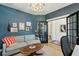 Comfortable living room featuring stylish decor, a modern light fixture, and a neutral sofa at 523 Coaxum Rd, Mount Pleasant, SC 29464
