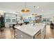 Open concept living space with a kitchen island, dining area, and comfortable living room at 523 Coaxum Rd, Mount Pleasant, SC 29464
