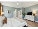 Spacious primary suite with a modern aesthetic, TV, walk-in closet, and elegant ensuite at 523 Coaxum Rd, Mount Pleasant, SC 29464