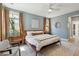 Relaxing bedroom with natural light, wooden accents, and chic decor at 523 Coaxum Rd, Mount Pleasant, SC 29464