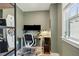 Well-lit home office featuring a sit-stand desk, ergonomic chair, and a large window for natural light at 523 Coaxum Rd, Mount Pleasant, SC 29464