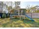 Fun backyard playhouse for with slide and climbing wall at 523 Coaxum Rd, Mount Pleasant, SC 29464