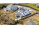 Aerial view showcasing backyard with patio, screened porch, and solar panels at 523 Coaxum Rd, Mount Pleasant, SC 29464