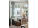 Comfortable sitting area with natural light, arm chair, and side table at 523 Coaxum Rd, Mount Pleasant, SC 29464
