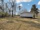 Backyard of home with a grassy lawn, mature trees, and a view of the surrounding landscape at 532 Finlay Ln, Cottageville, SC 29435