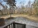 View from home's back deck, showing a large grassy lawn and many mature shade trees at 532 Finlay Ln, Cottageville, SC 29435