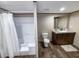 Bright bathroom with a shower-tub combo with tile surround and modern vanity at 532 Finlay Ln, Cottageville, SC 29435
