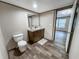 Bathroom featuring wood-look floors, a modern vanity with a framed mirror, and a toilet at 532 Finlay Ln, Cottageville, SC 29435