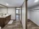 Bathroom featuring wood-look floors, a modern vanity with a framed mirror and a walk-in closet at 532 Finlay Ln, Cottageville, SC 29435