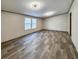 A spacious bedroom has hardwood floors, neutral walls, recessed lighting, and large windows at 532 Finlay Ln, Cottageville, SC 29435